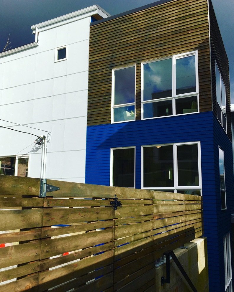 A finished BDR Homes townhome with cedar and blue lap siding