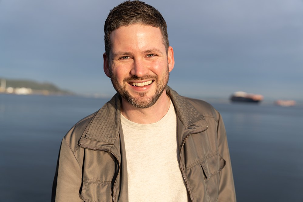 Keenan Bennett on the Seattle waterfront in golden evening light